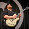 A photo of Wolfgang Van Halen playing guitar